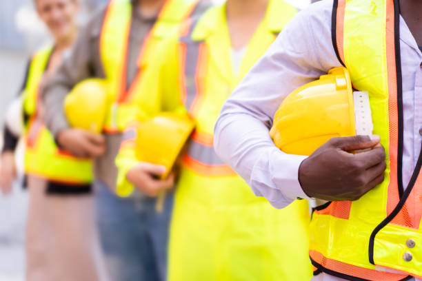 Industrial workers using safety equipment